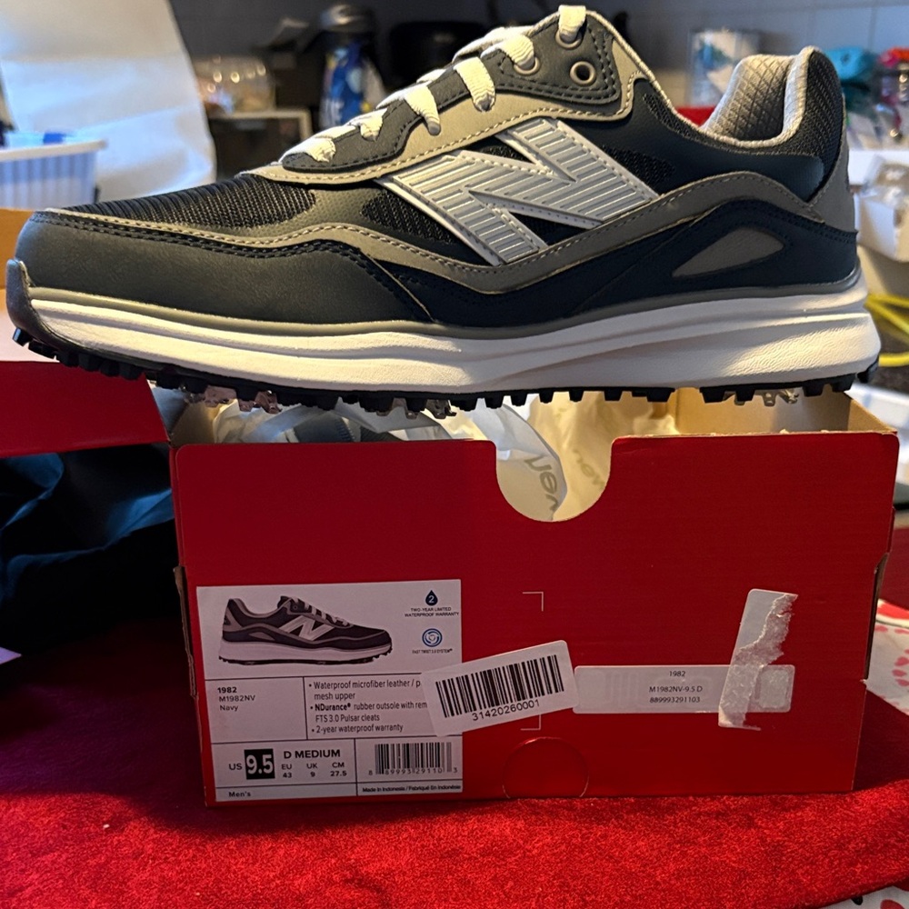 New Balance Grey and navy  Men's Sneaker/golf shoes wcleats size 9.5;10.5 women